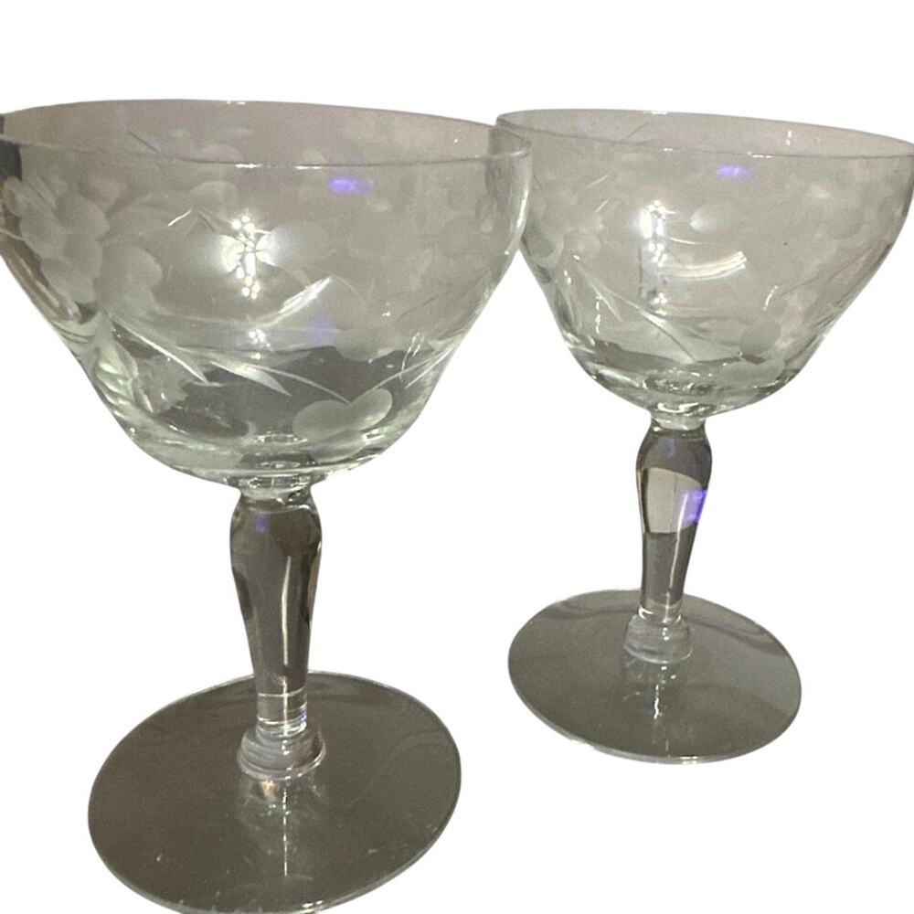 vintage etched crystal champagne coupe glasses featuring a floral and vine motif
